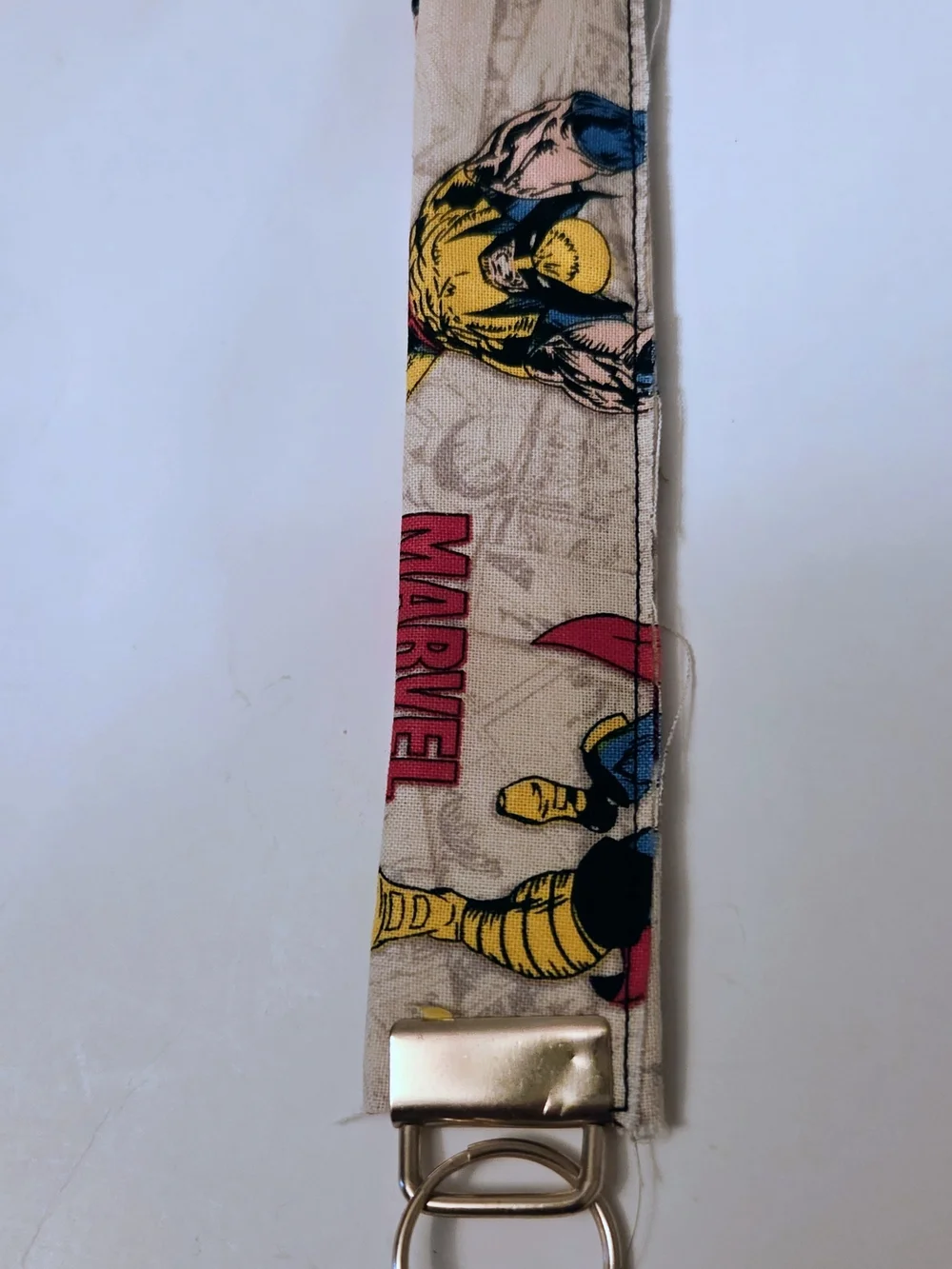 Marvel Beige Comic-Print Wristlet Keychain with Yellow & Blue Accents